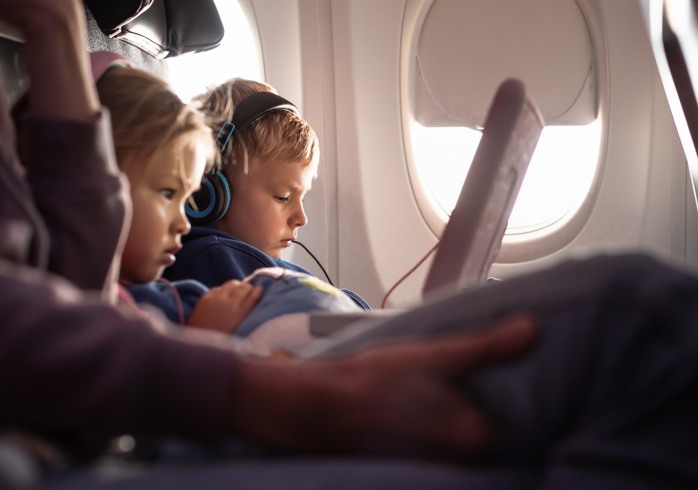 Children under 14 sit free next to their parents. Photo: Shutterstock