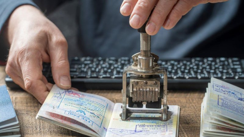 Passport inspection. Photo: SHUTTERSTOCK