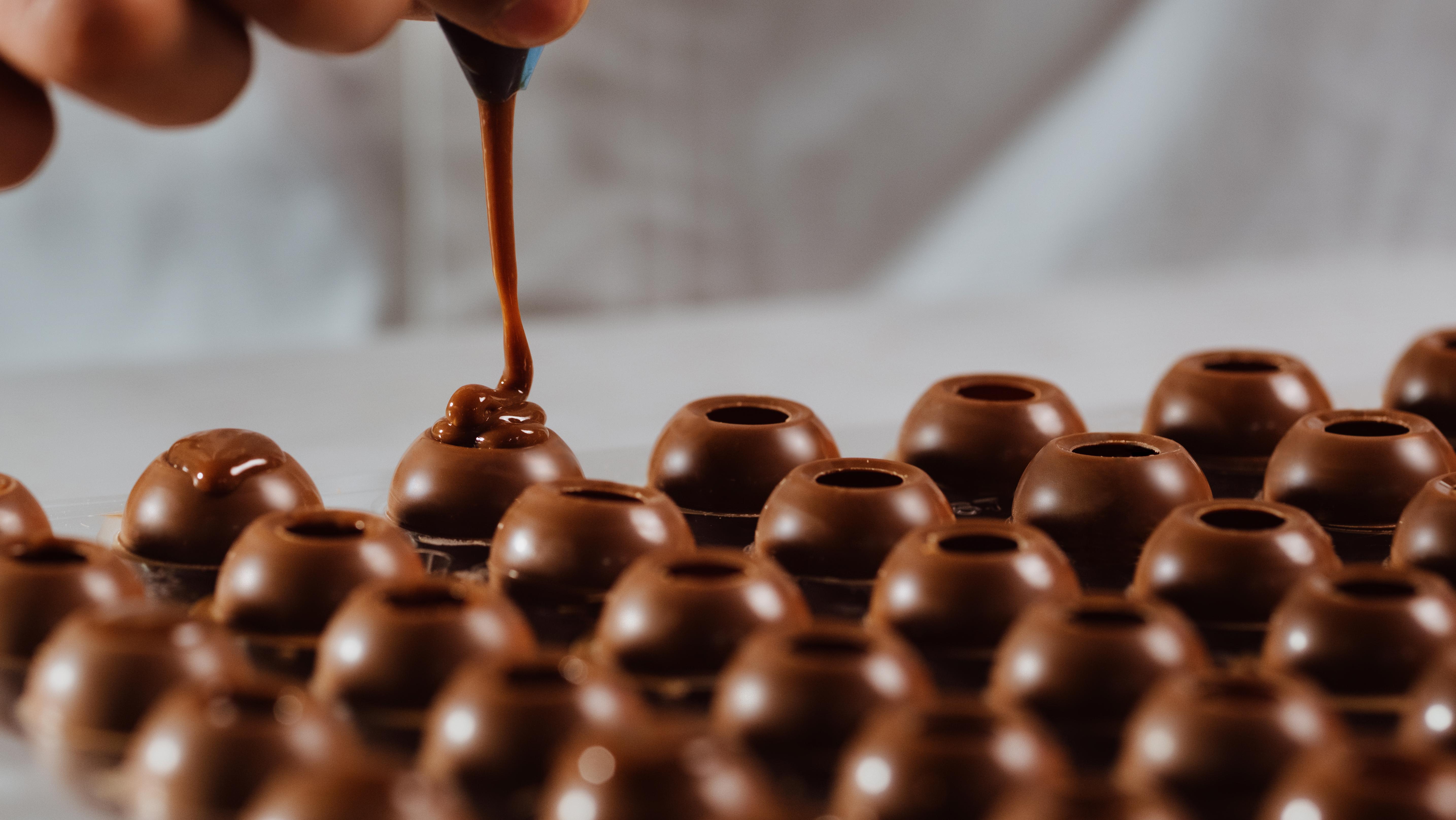 Emirates' chocolate truffles being expertly filled. Photo: Emirates