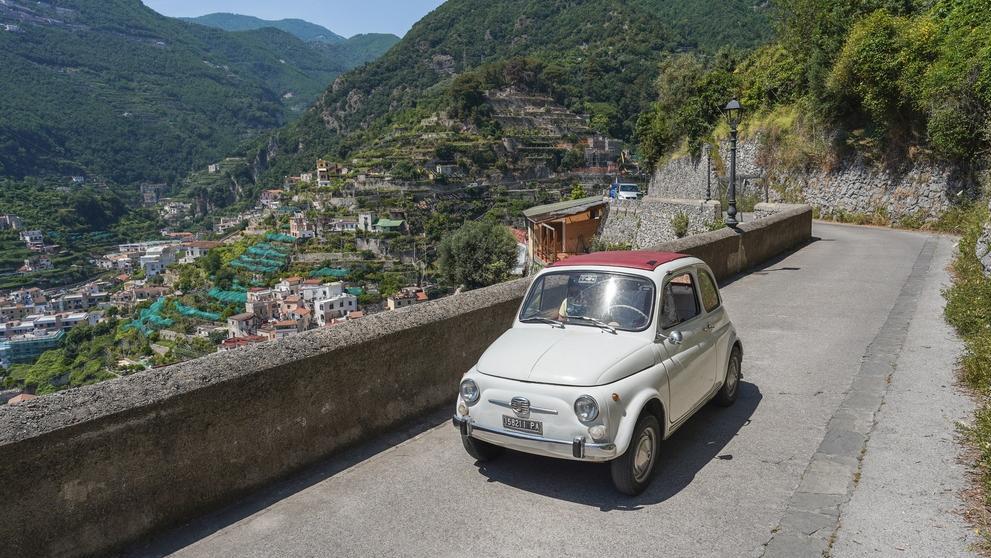 Car on beautiful Italian road. Photo: WildSnap / Shutterstock