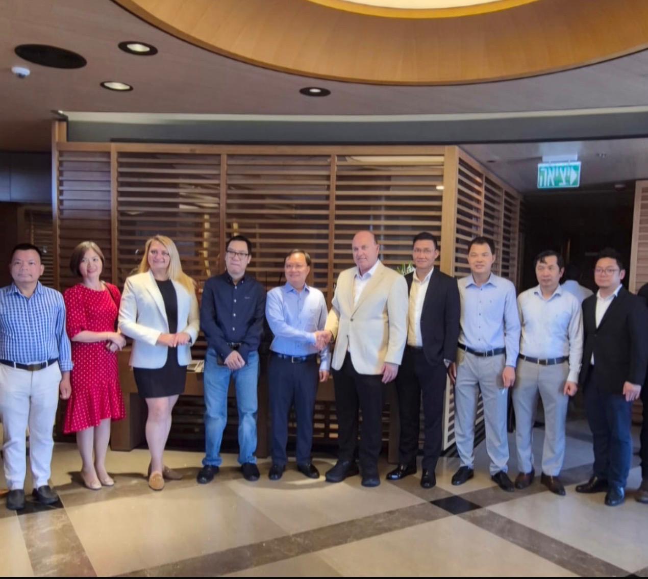   The person entering the center is welcomed by the Vietnamese Embassy staff and representatives from the business and diplomatic community at the Naor Center and the Ambassador.