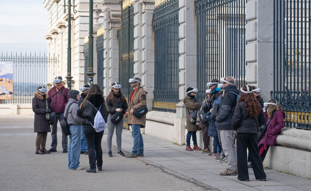 Tourists on VR guided tour at the Royal Palace in Madrid. Photo: Laura Polo / Shutterstock