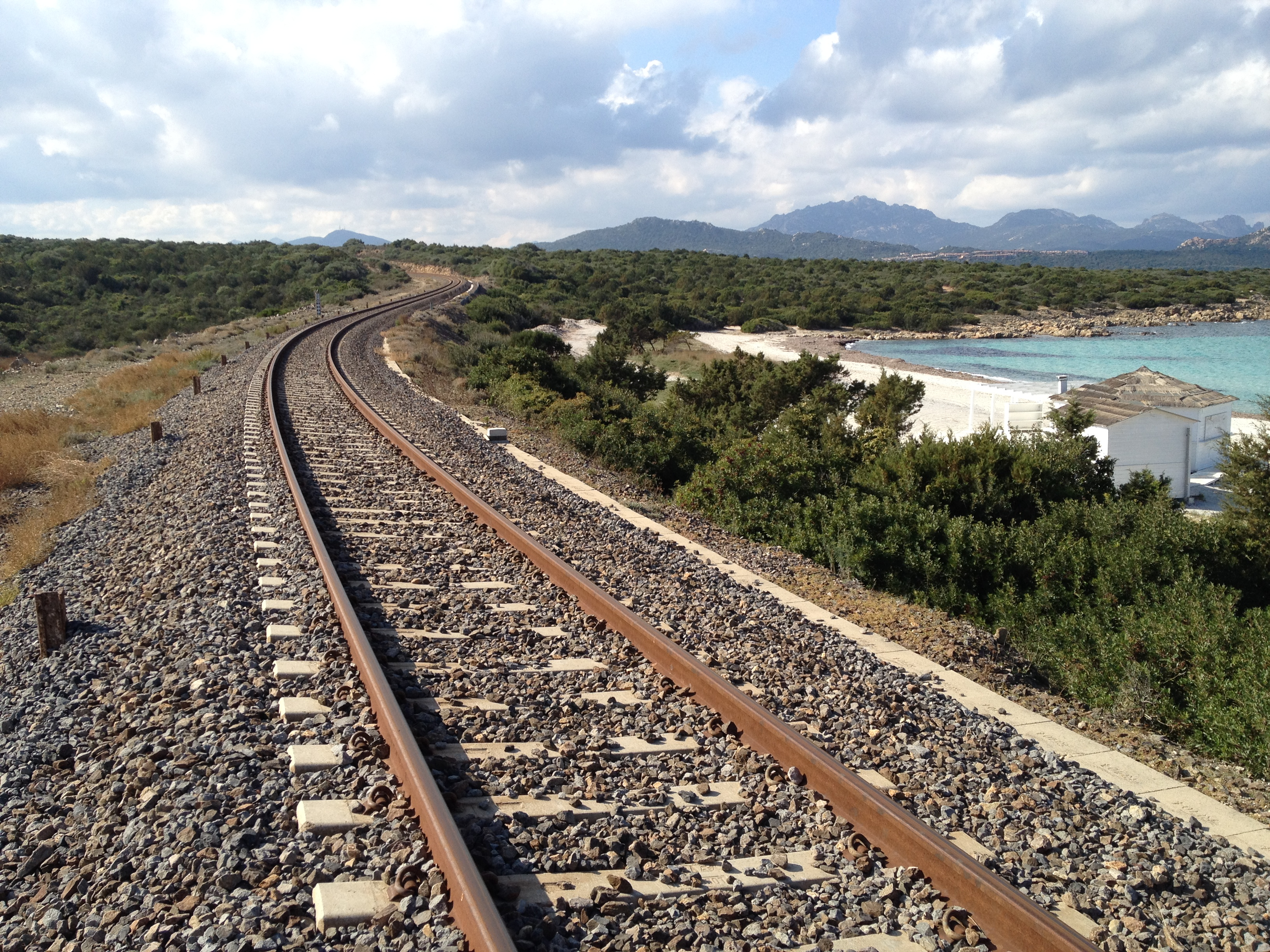 Train tracks at Cala Sabina bay, Golfo Aranci Sardinia of Trenitalia Railways. Photo: Shutterstock