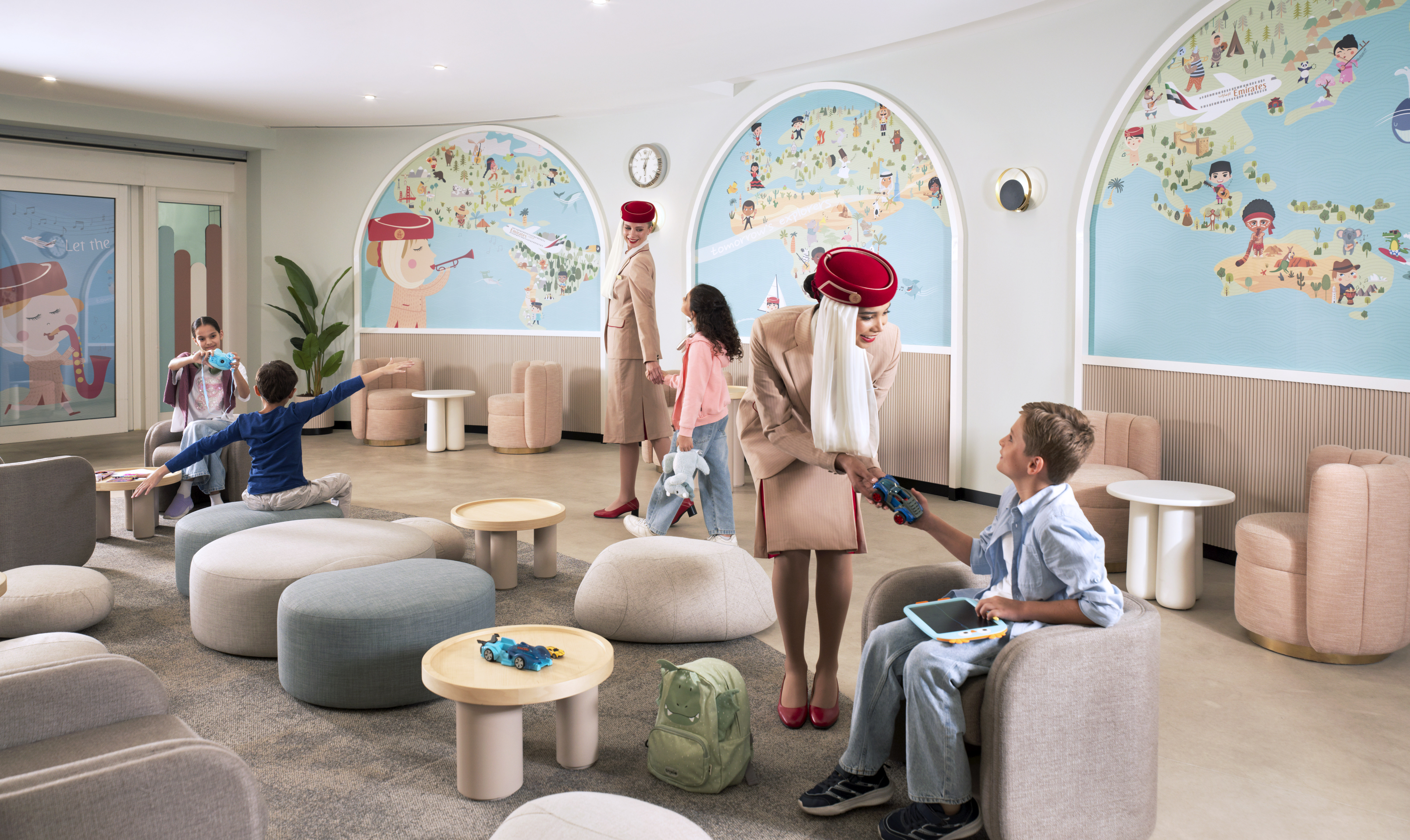 Emirates staff welcoming and engaging with children inside the dedicated Unaccompanied Minors lounge. Photo: Emirates