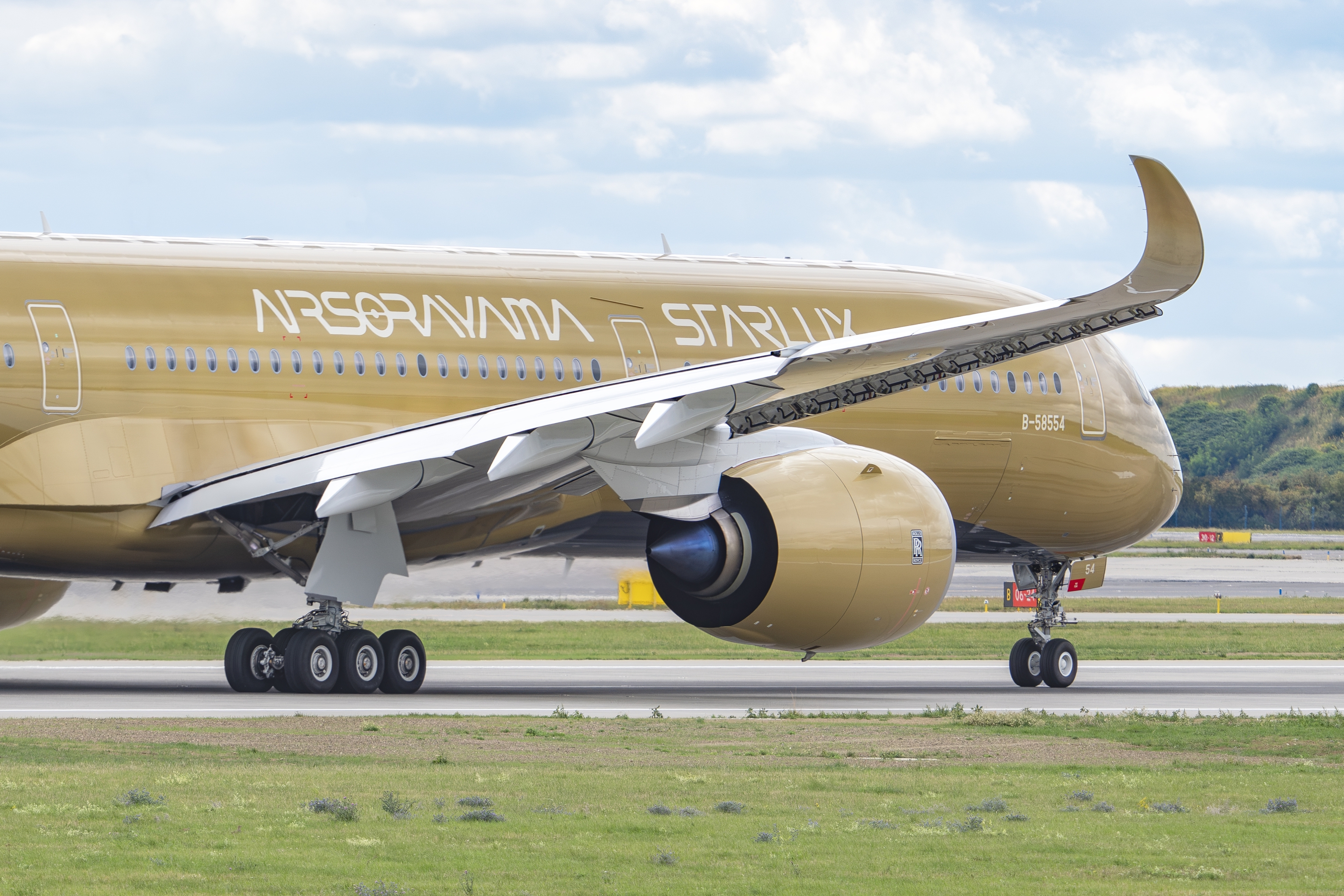 STARLUX's golden plane. Photo: kamilpetron / Shutterstock.com